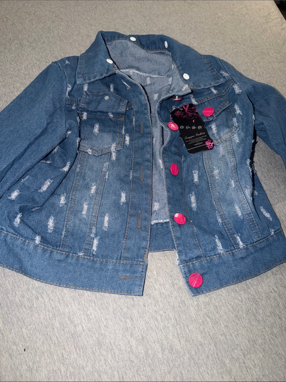 Distressed Blue Denim Jacket with Pink Buttons